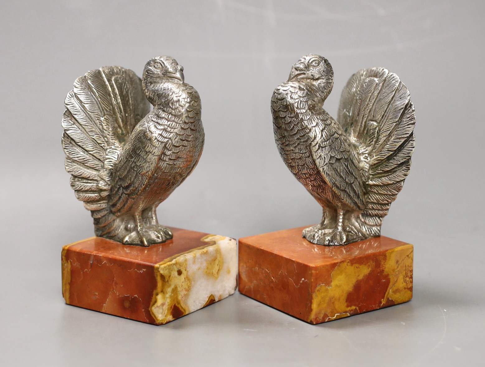 A pair of Art Deco silvered bronze 'turkey' bookends, 13cm high